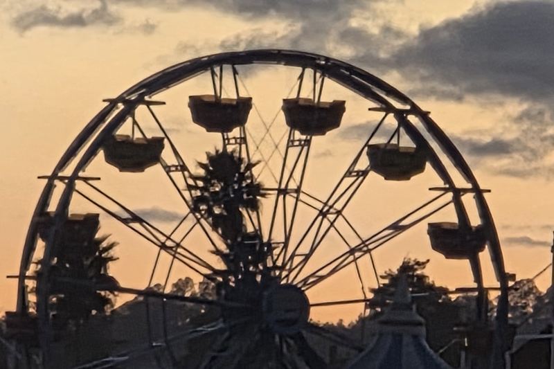 Ferris wheel in silhouette