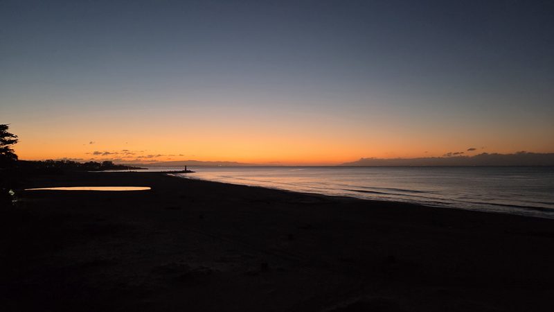 Orange dawn on a glassy sea