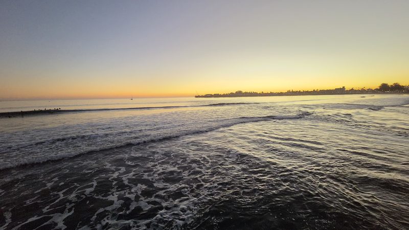 Amber twilight over rolling surf