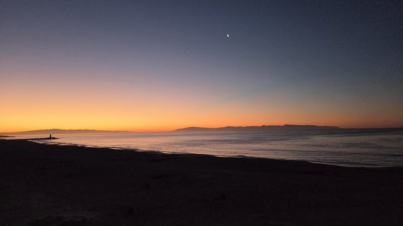 Crescent moon above the amber horizon