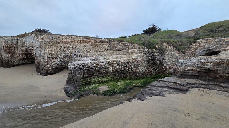 Weathered sea caves in the cliff